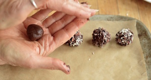 Chocolate truffles in hands