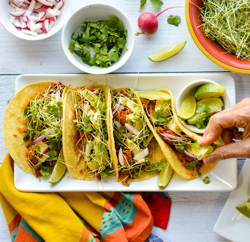 Chicken tacos squeezing lime