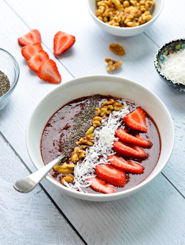 cherry green smoothie bowl with nuts