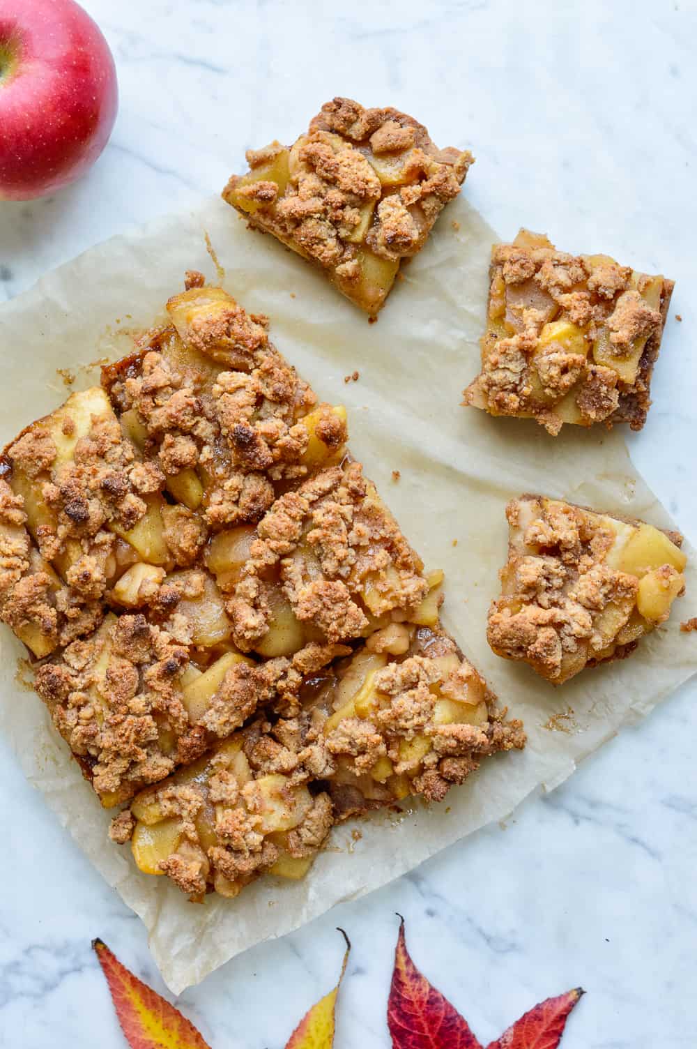 Cookie Crumb Apple Bars on parchment cut