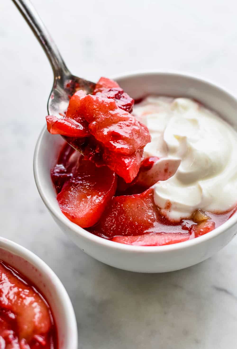 Sauteed Pears with Raspberries and Coconut Yogurt on spoon