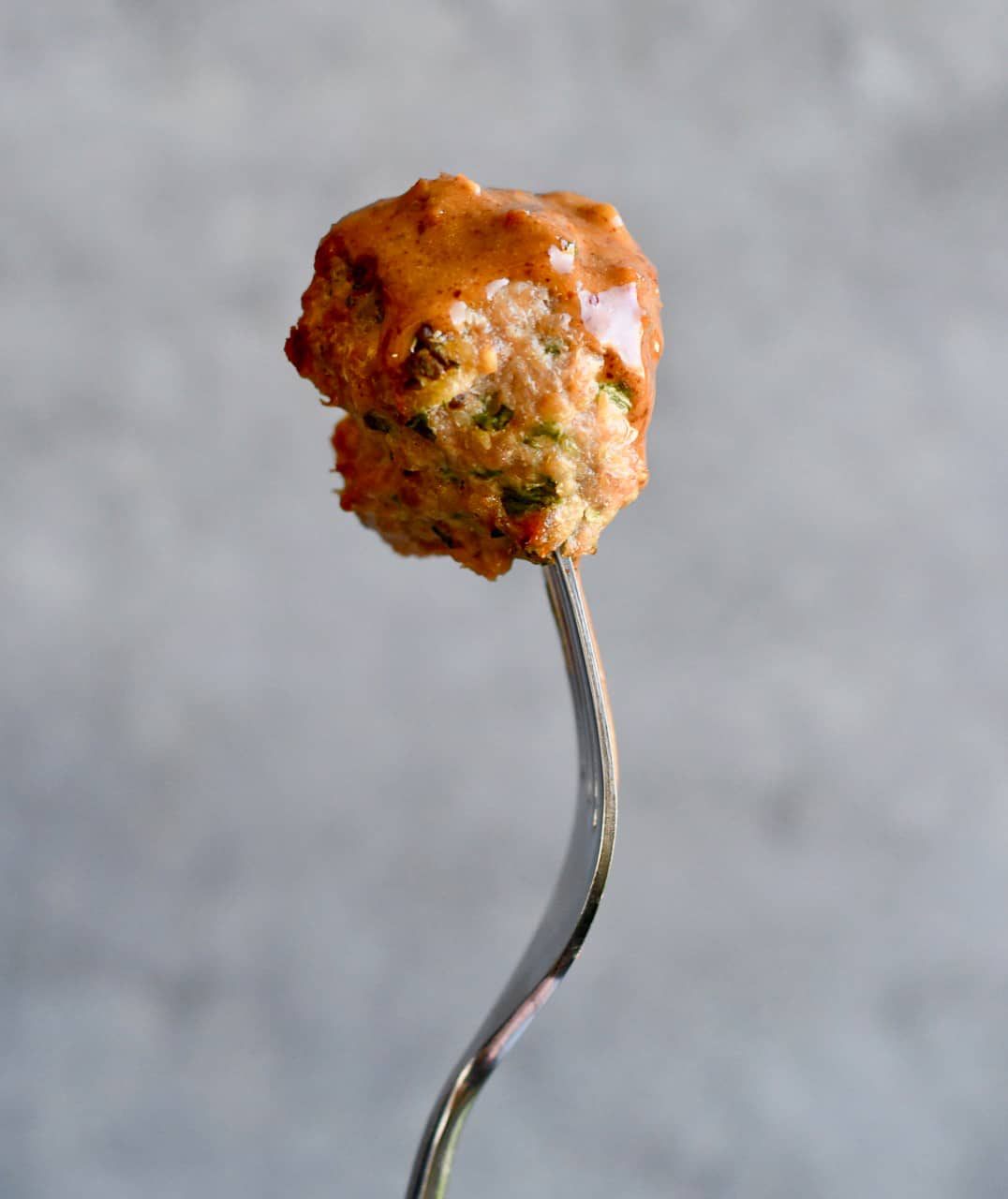 Asian Meatballs with Thai 'Peanut' Sauce on fork