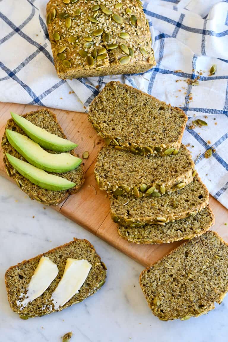 Slices of seed bread on a cutting board.