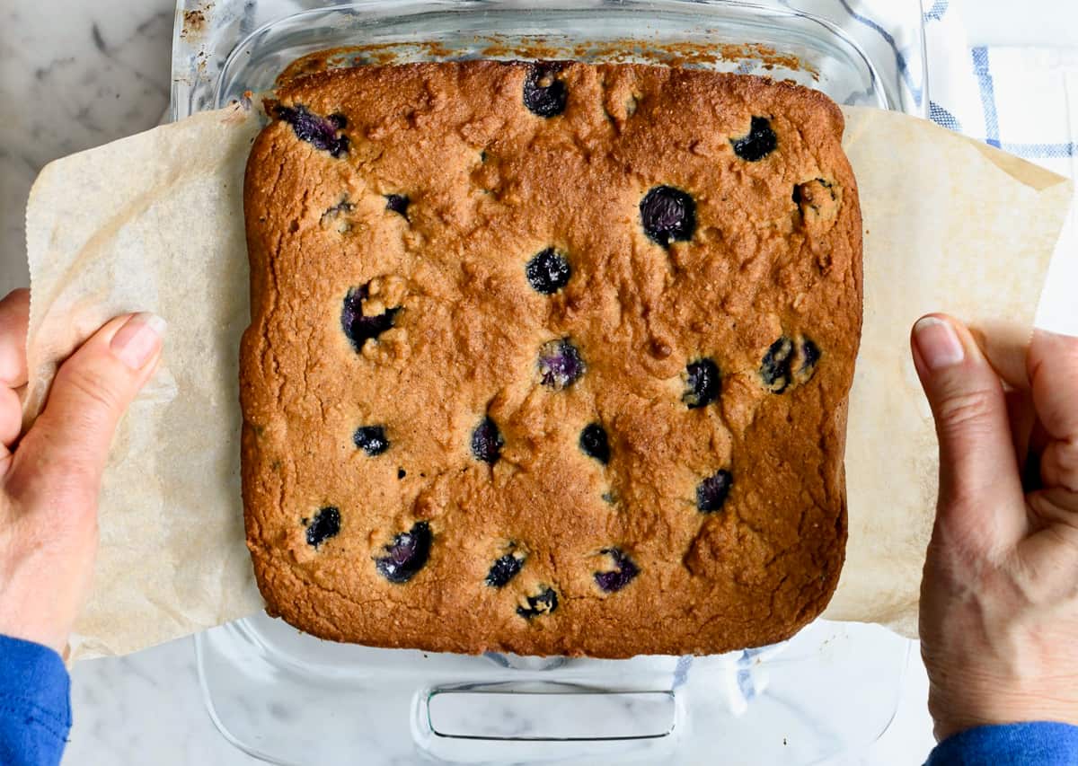 Paleo Blueberry Coffee Cake lifting out of pan