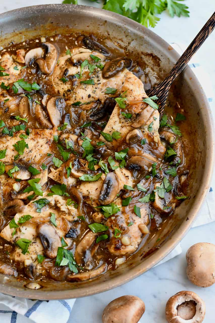Paleo Mushroom Chicken in pan with spoon