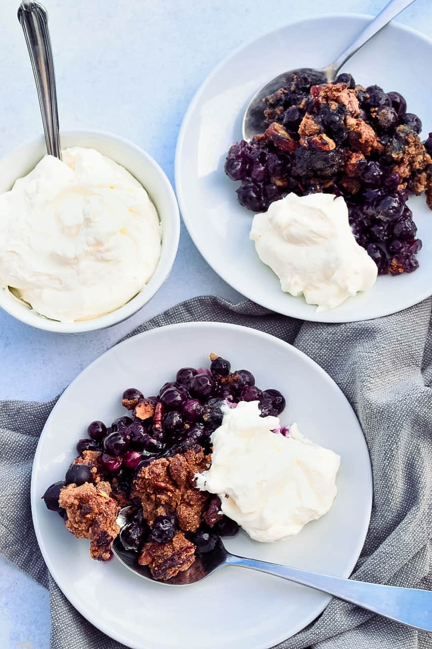 Easy Blueberry Cobbler 2 plates with whipped cream