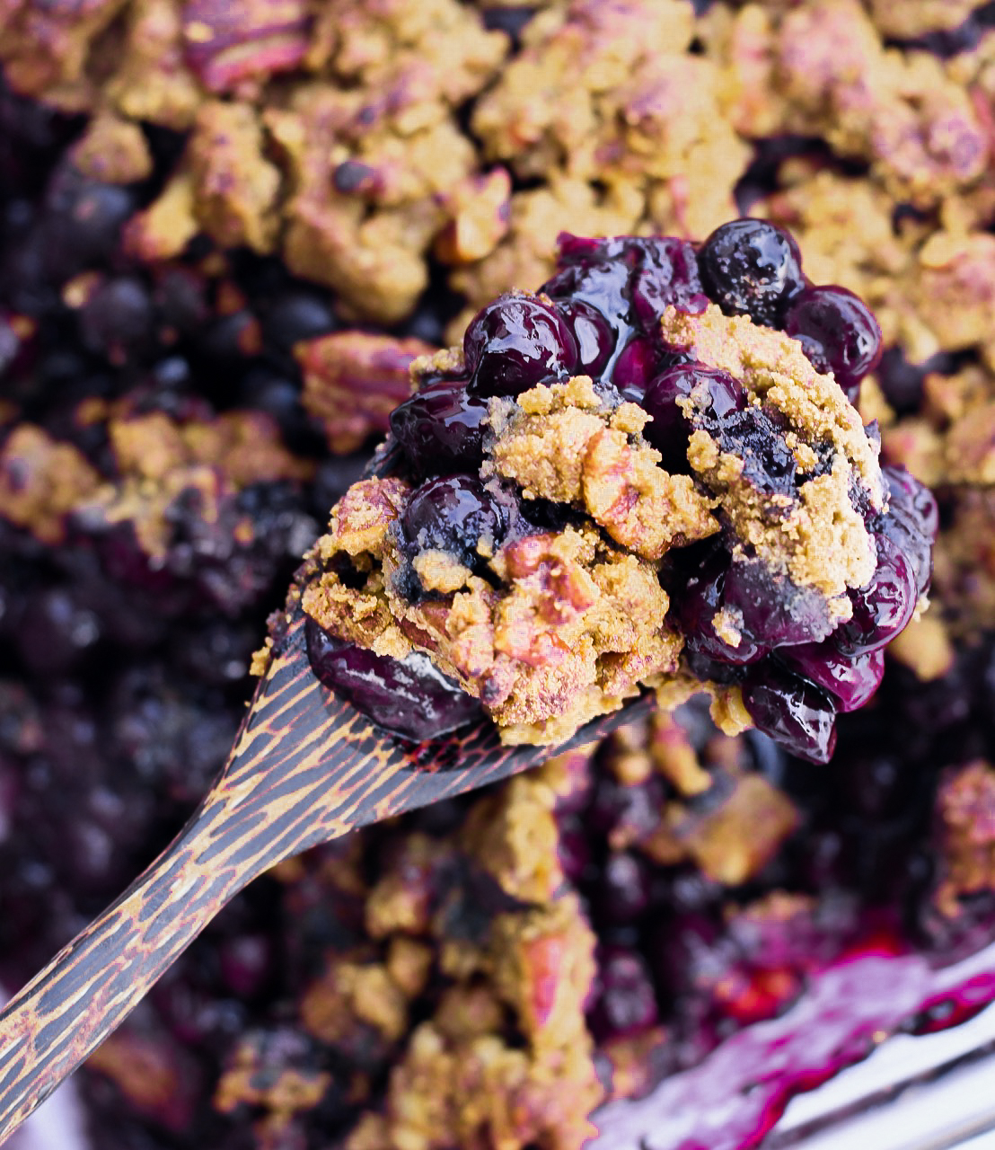 Easy Blueberry Cobbler close up with serving spoon