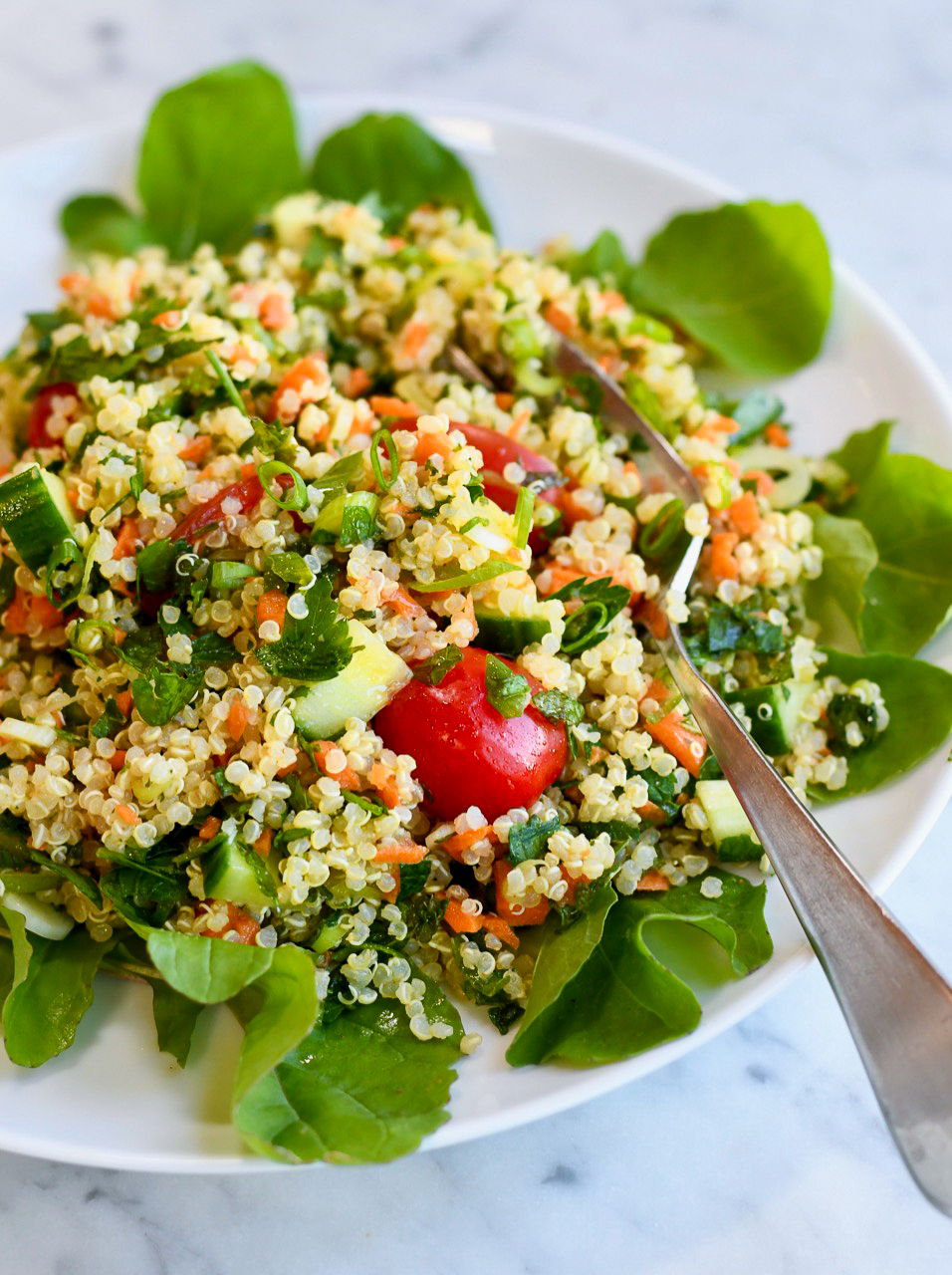 Quinoa Tabbouleh Salad on plate with fork