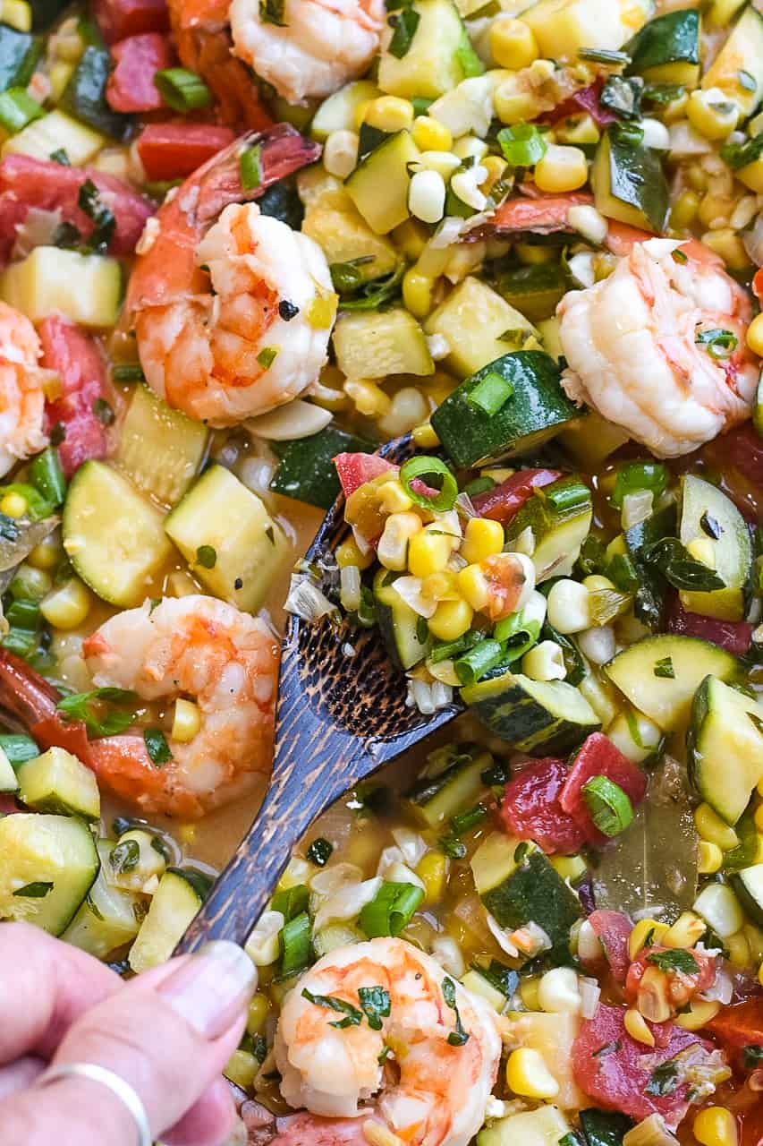 Easy Shrimp and Summer Vegetables close up with wooden spoon
