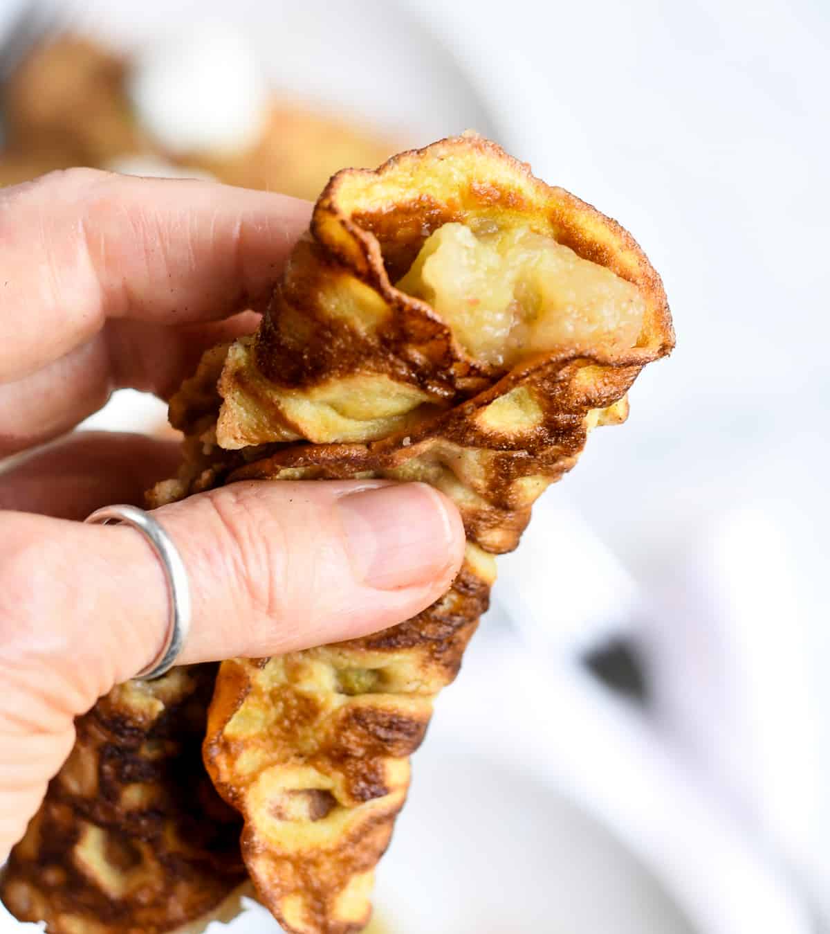 Grain free apple crepes holding in hand