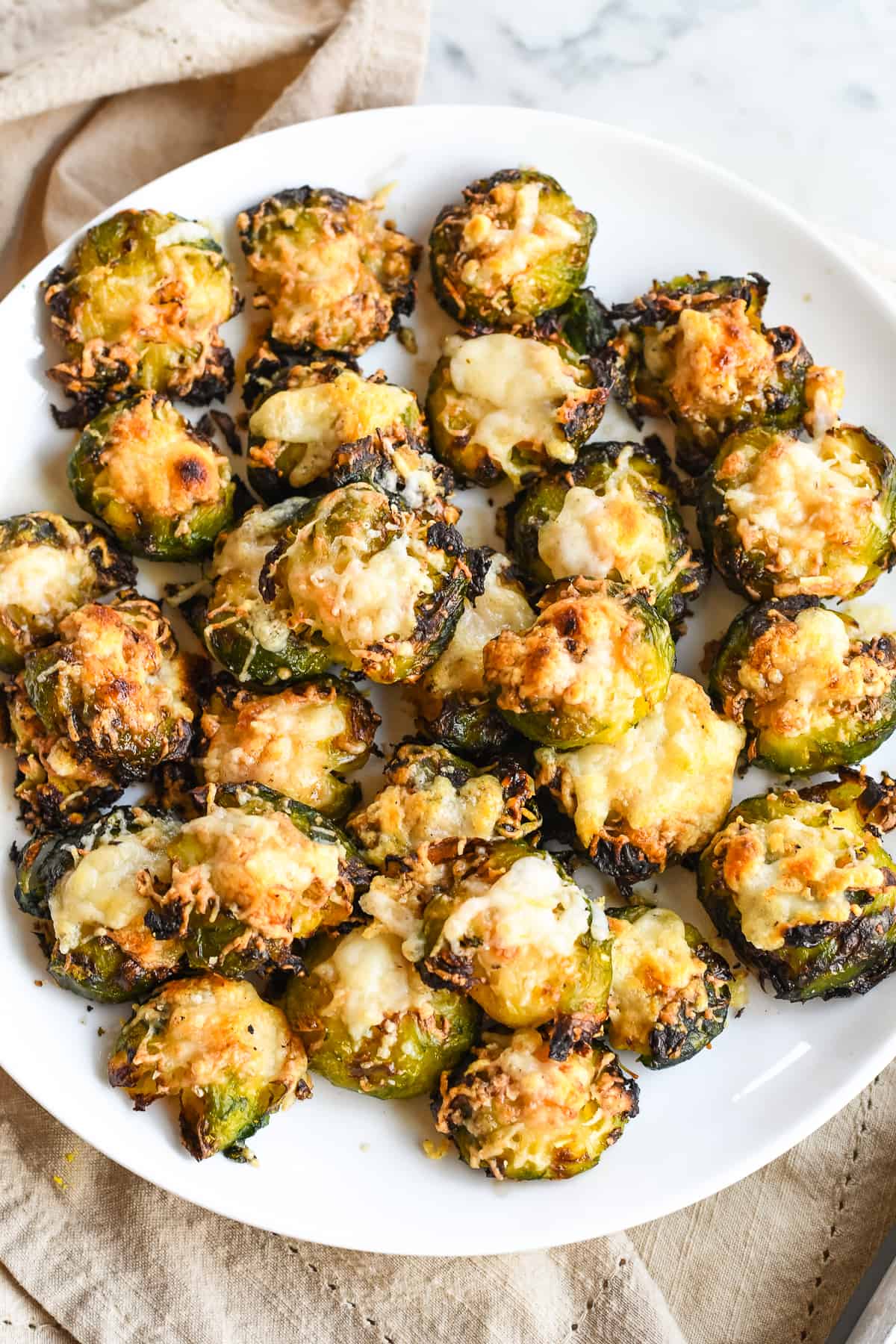 Crispy Smashed Brussels Sprouts on plate with napkin