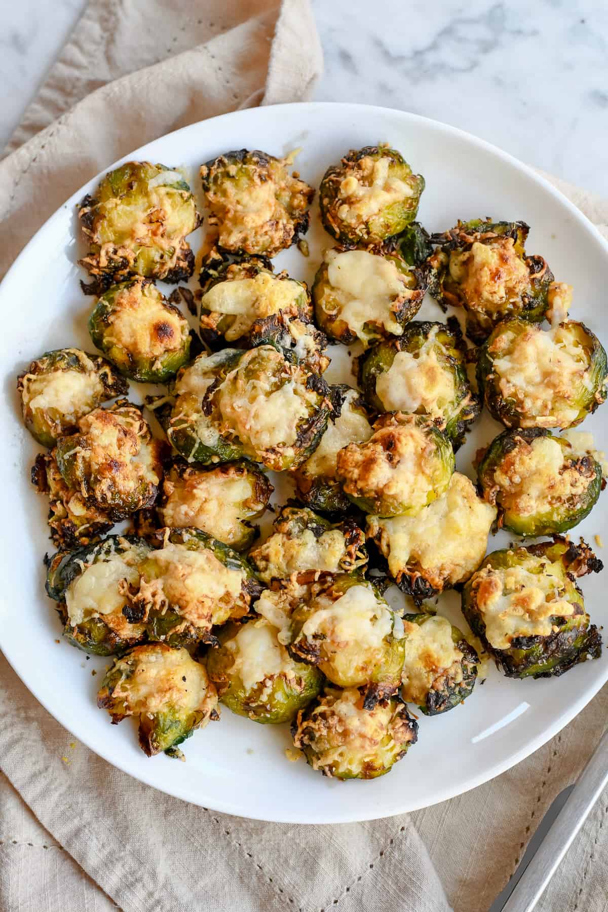 Crispy Smashed Brussels Sprouts on plate close up.