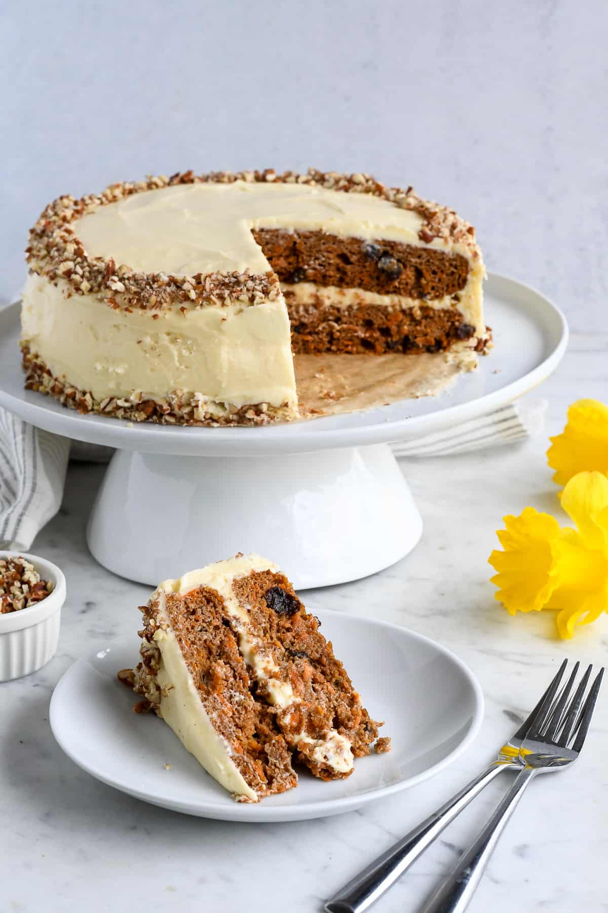 Best Gluten Free Carrot Cake whole cake with slice on plate