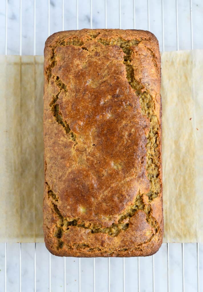 paleo banana bread loaf on a wire rack overview
