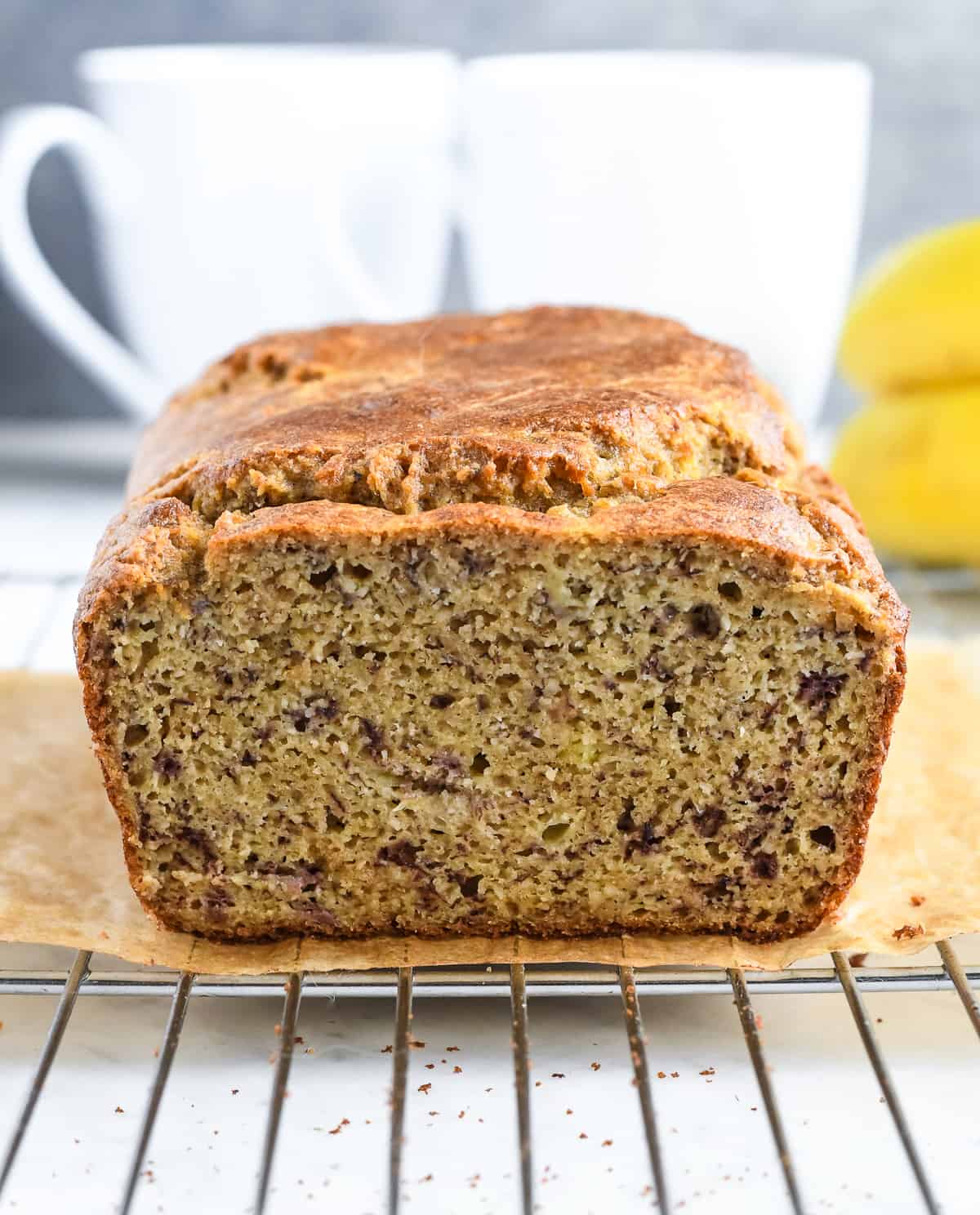paleo banana bread on wire rack showing the front of the bread