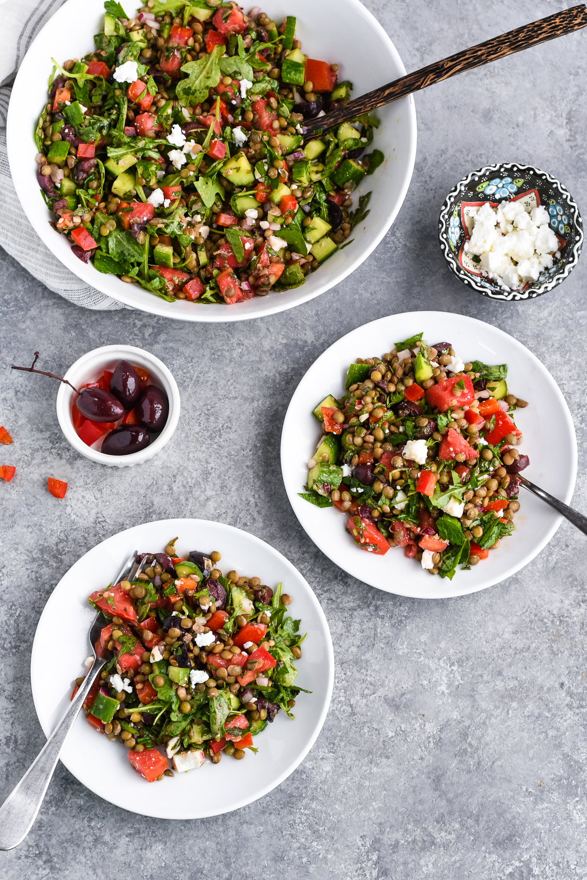 Mediterranean French Lentil Salad serving bowl, 2 plates with forks