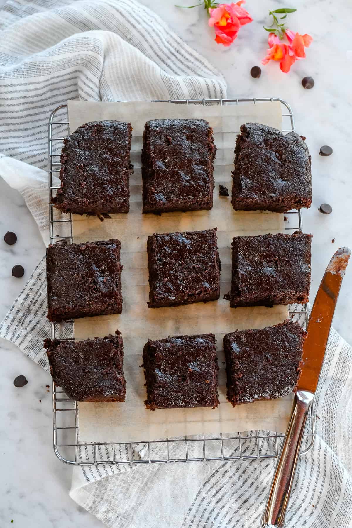 Healthy Zucchini Brownies Gluten Free  on cooling rack with napkin and knife