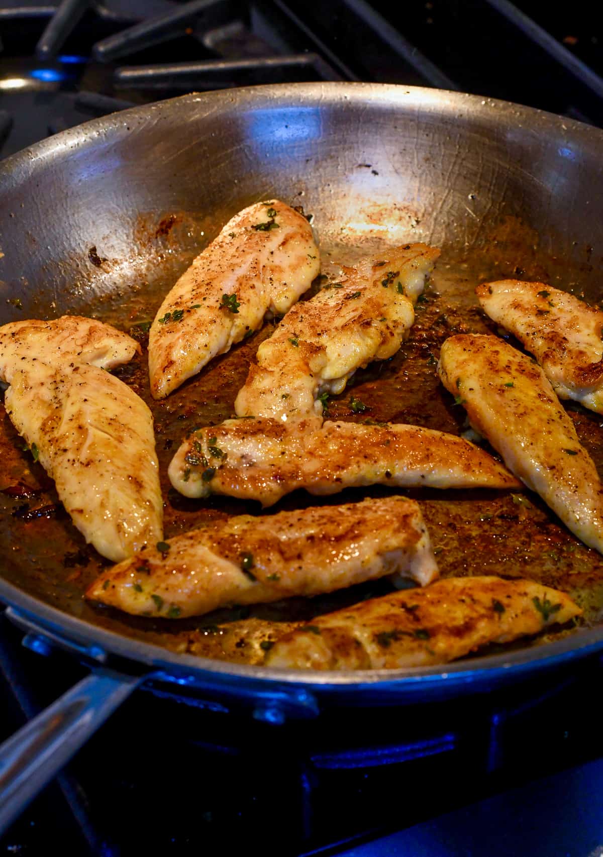 Easy Sautéed Chicken and Apples chicken being sauteed in the pan