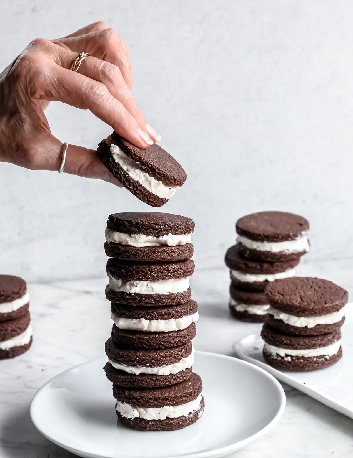 Healthy Homemade Oreos hand putting cookie on stack