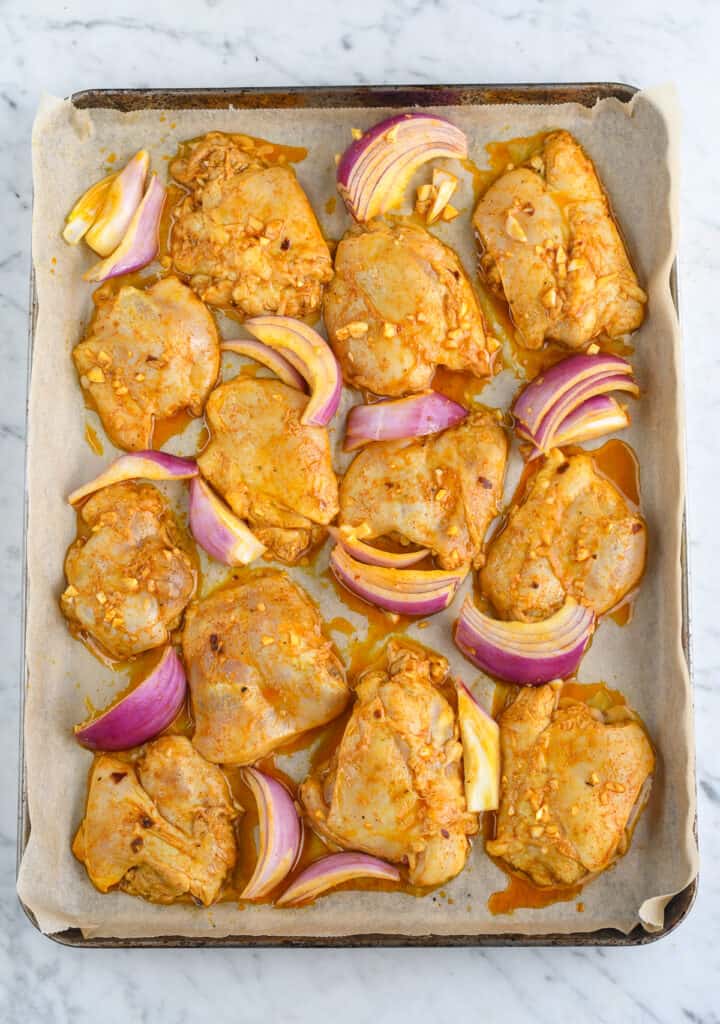 Oven Roasted Chicken and Vegetable Shawarma chicken raw on baking tray