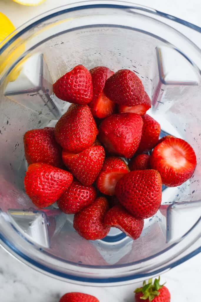 Homemade Strawberry Lemonade strawberries and sweetener in blender unblended