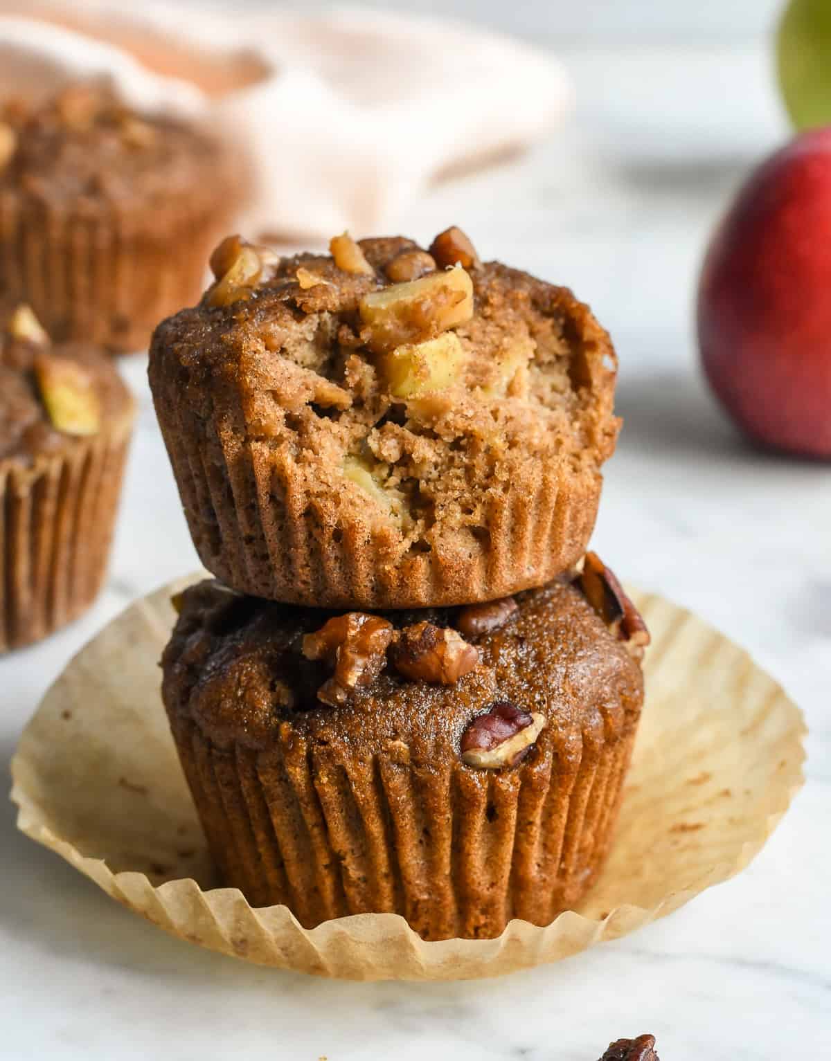 Healthy Apple Muffins 2 muffin stacked with a bit out of the top one