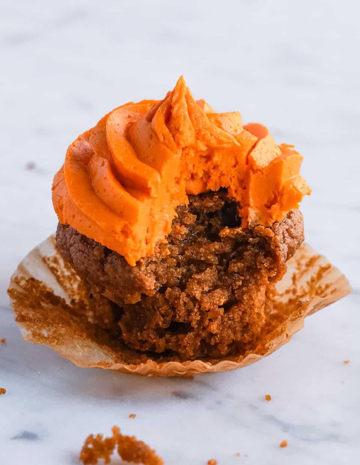 Gluten Free Pumpkin Cupcake close up of a cupcake with a bit taken out