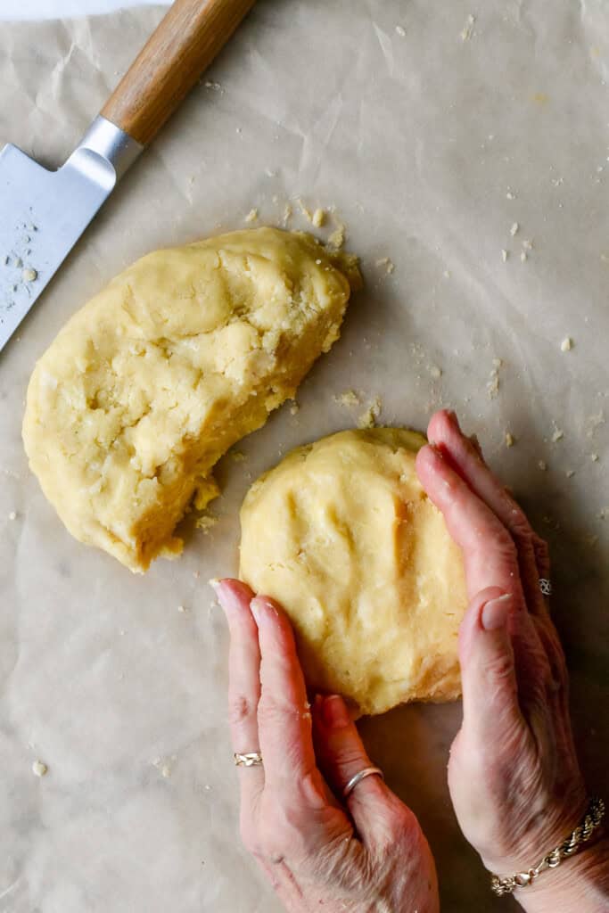 Paleo Apple Pie cutting the dough in half and shaping into discs