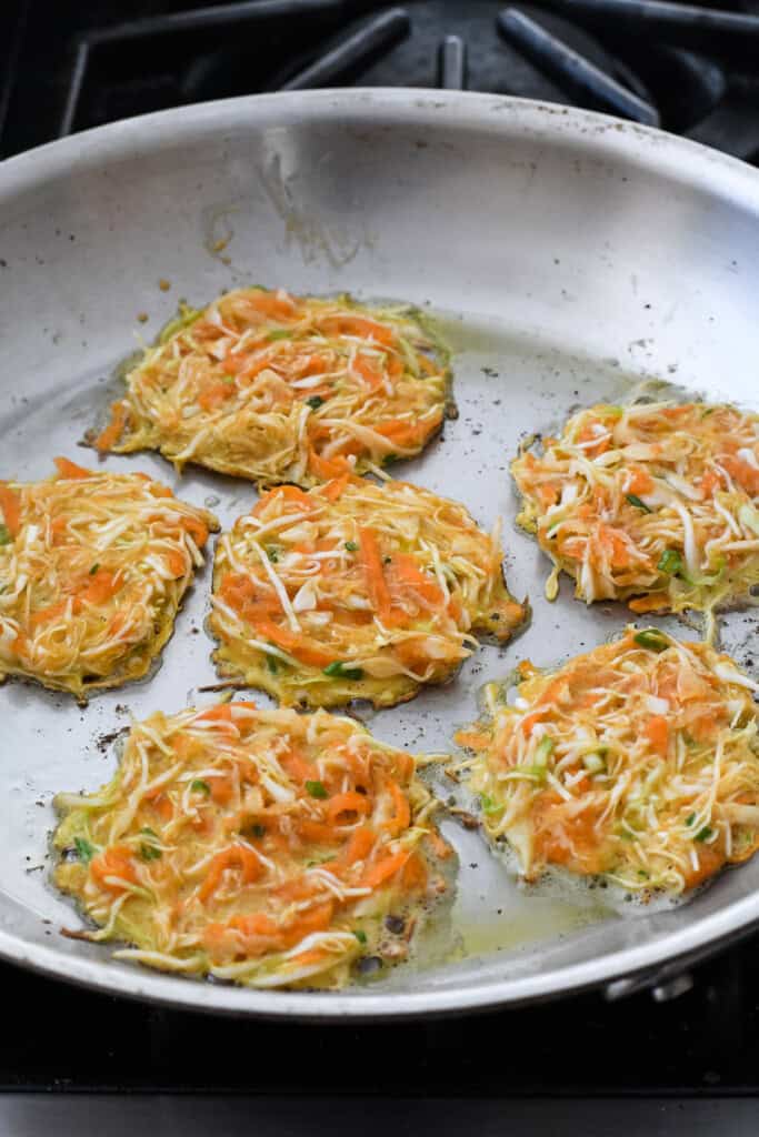 Cabbage Fritters (Gluten Free) in pan first side cooking