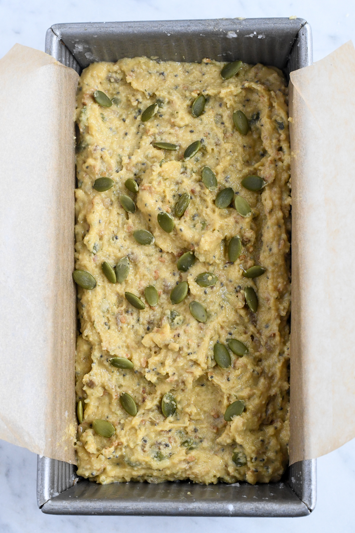 Easy Paleo Seed Bread (Gluten Free) in bread pan unbaked