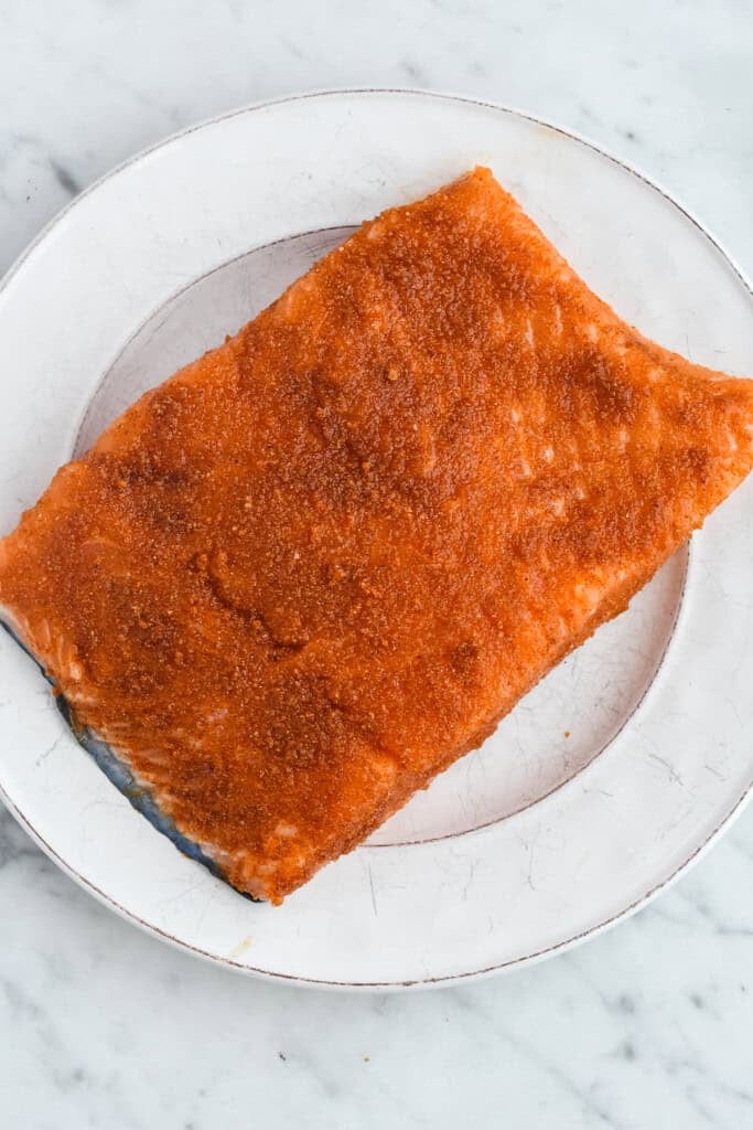  Indian-Spiced Salmon raw salmon with spice rub on top and sides