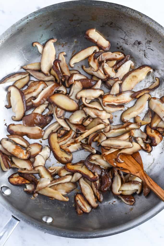 Sautéed Shiitake Mushrooms in pan cooking