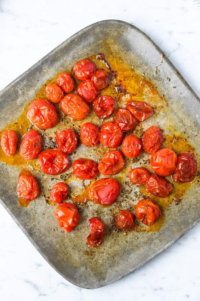 Creamy Whipped Feta with Roasted Cherry Tomatoes on roasting tray cooked
