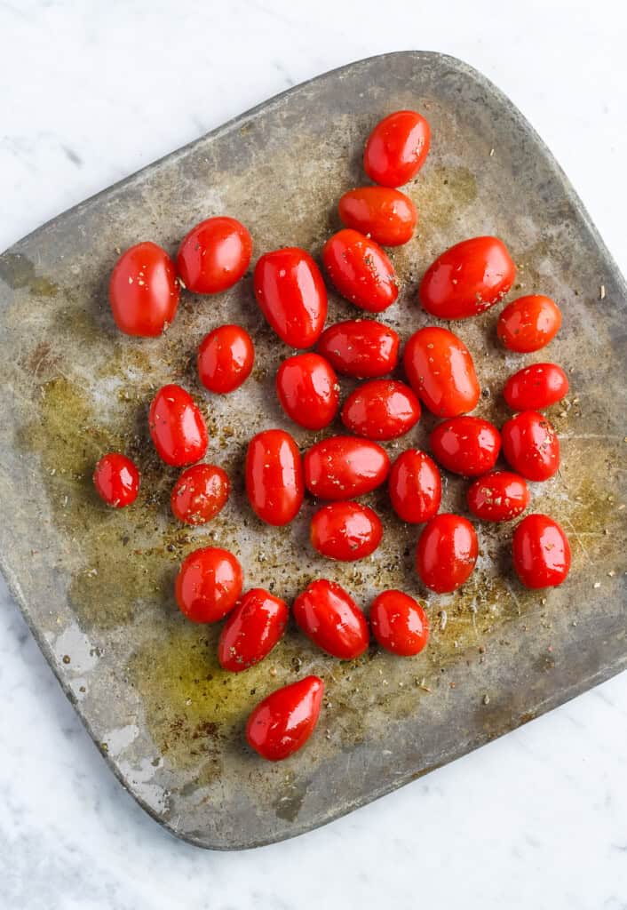 Creamy Whipped Feta with Roasted Cherry Tomatoes cherry tomatoes on roasting tray uncooked