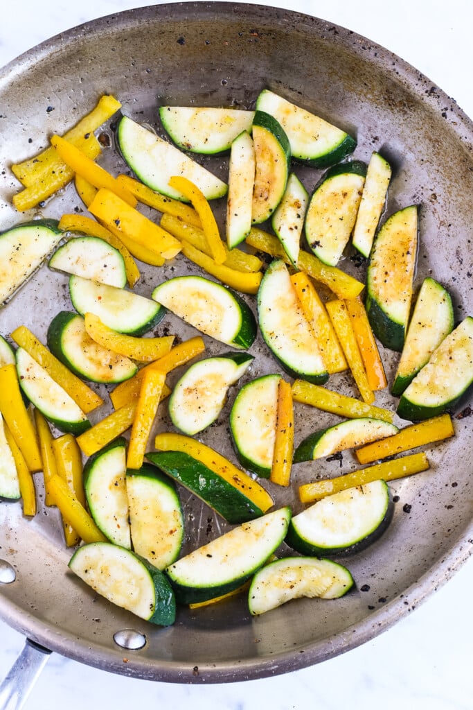 Mediterranean Shrimp Skillet with Vegetables zucchini and pepper sautéing in skillet 