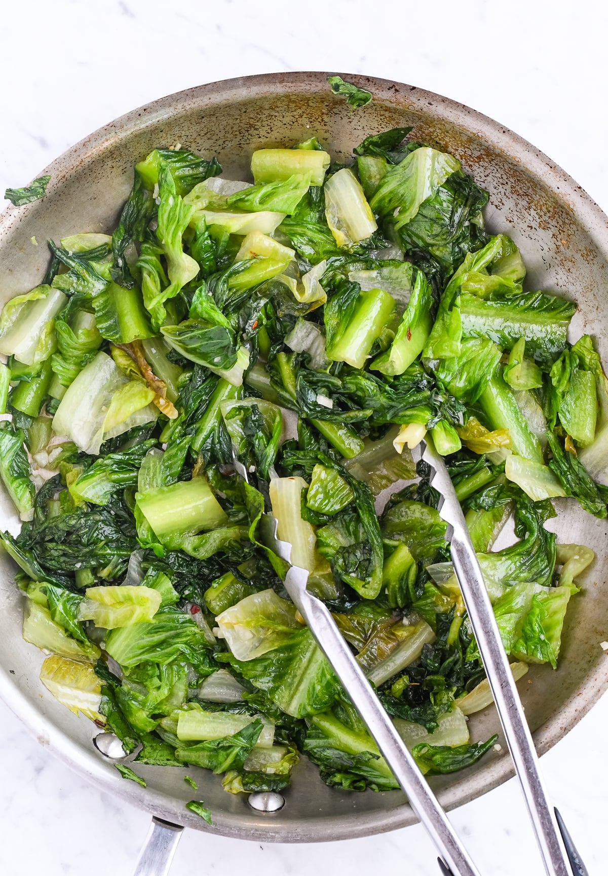 Easy Sautéed Romaine in pan cooked with tongs