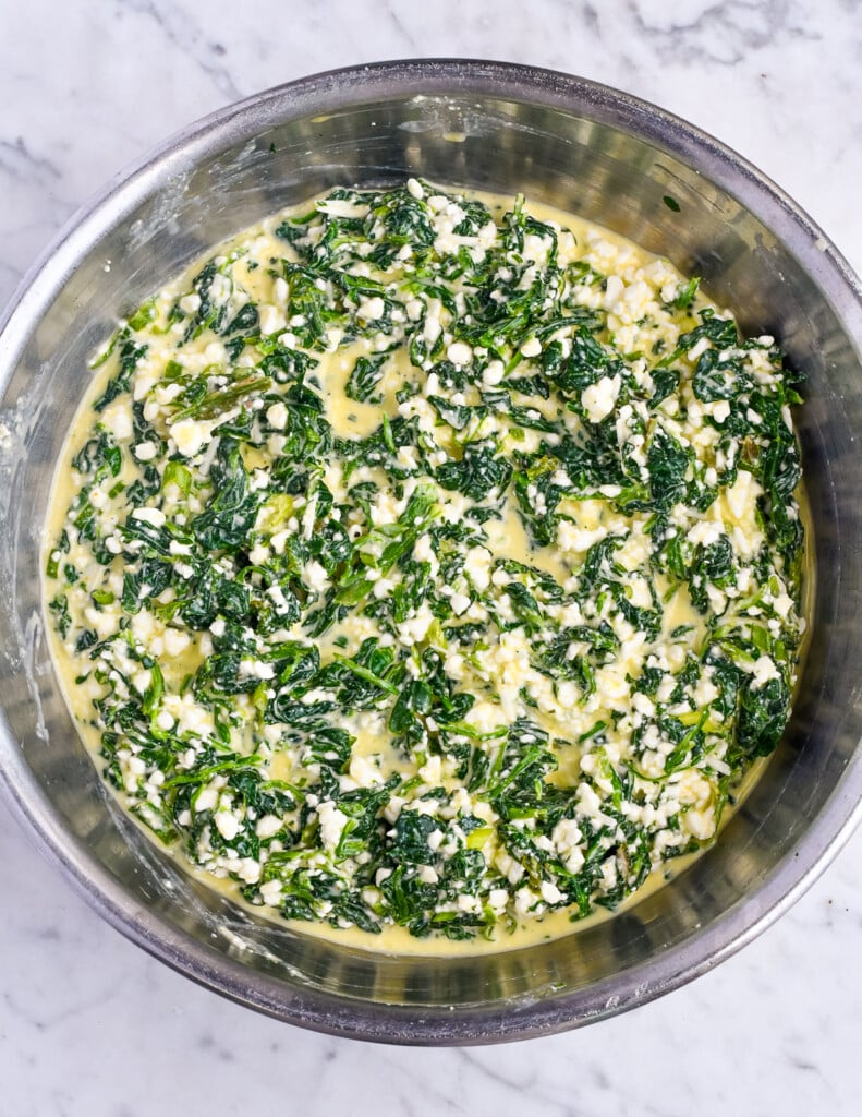 High Protein Spinach Egg Bites filling in bowl everything mixed together