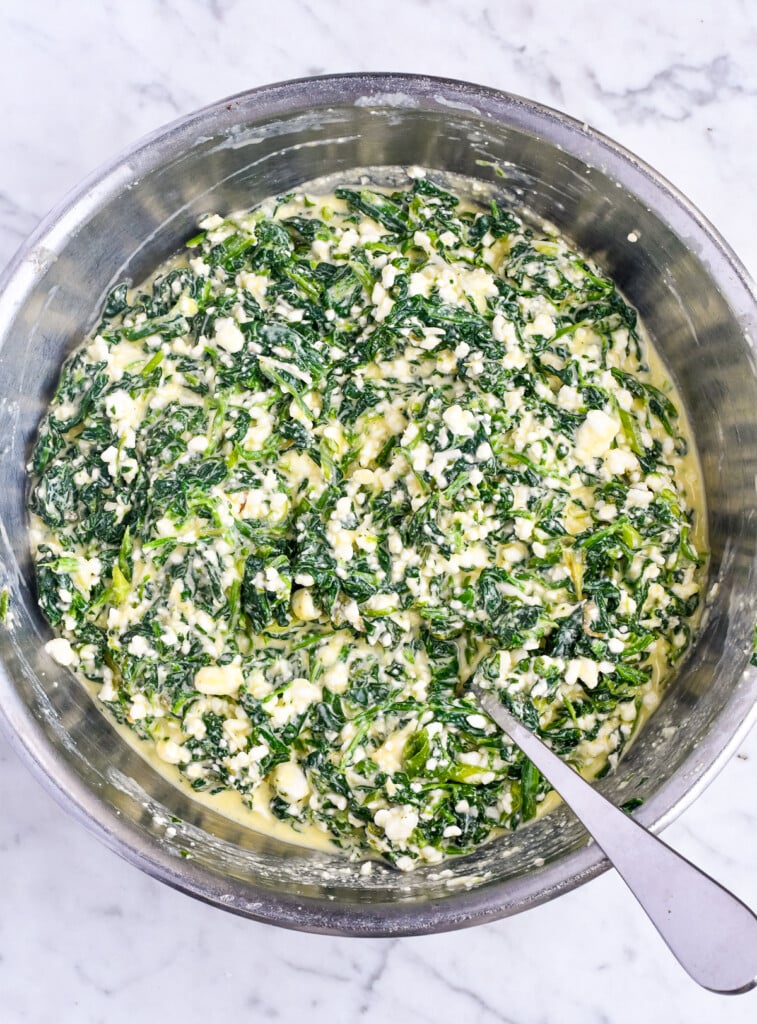 High Protein Spinach Egg Bites egg mixture combined with spinach and cottage cheese mixture