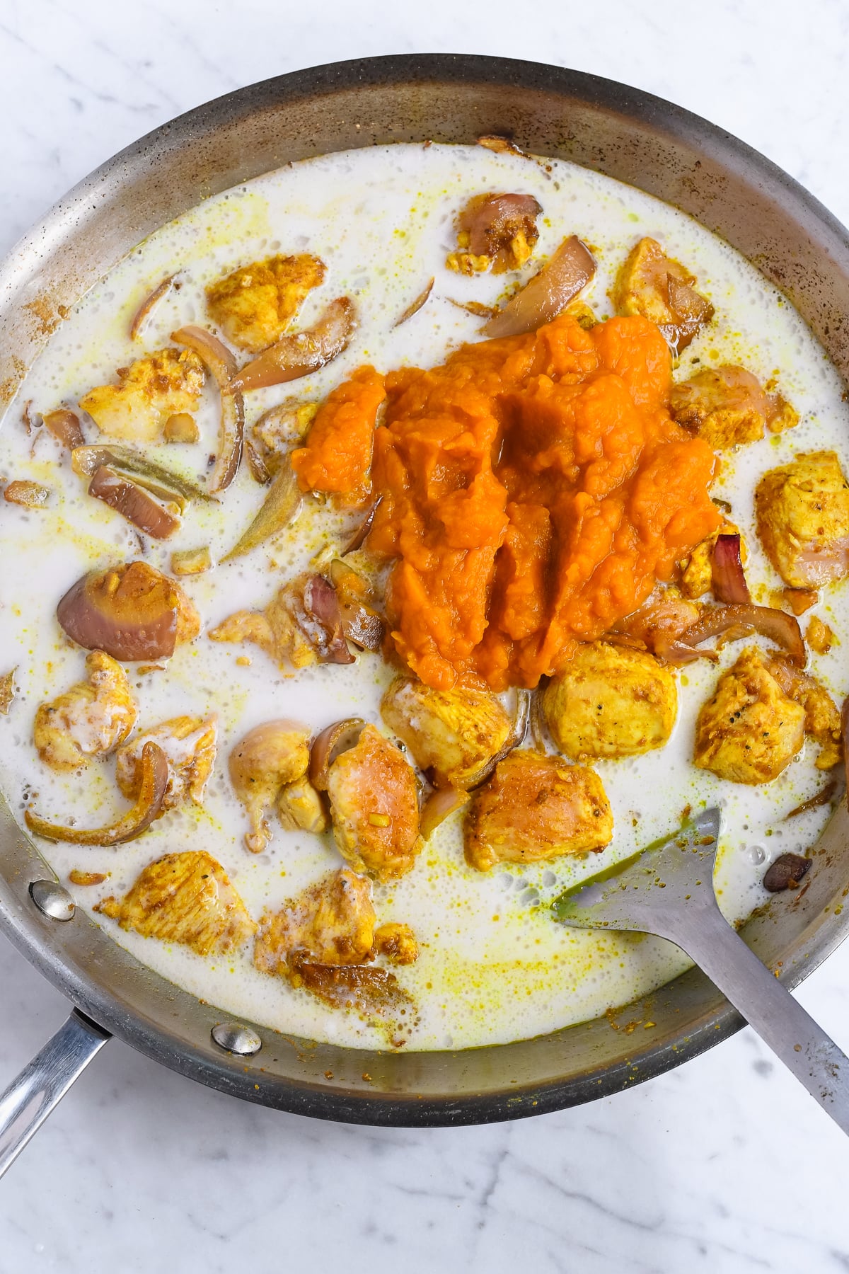 Creamy Pumpkin Curry with Coconut Milk adding pumpkin and coconut milk unmixed